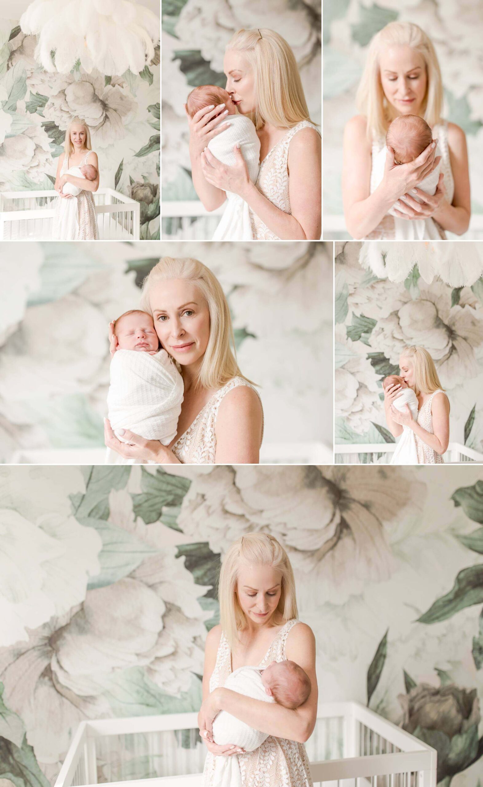 Beautiful blonde mom holding daughter with flower backdrop.