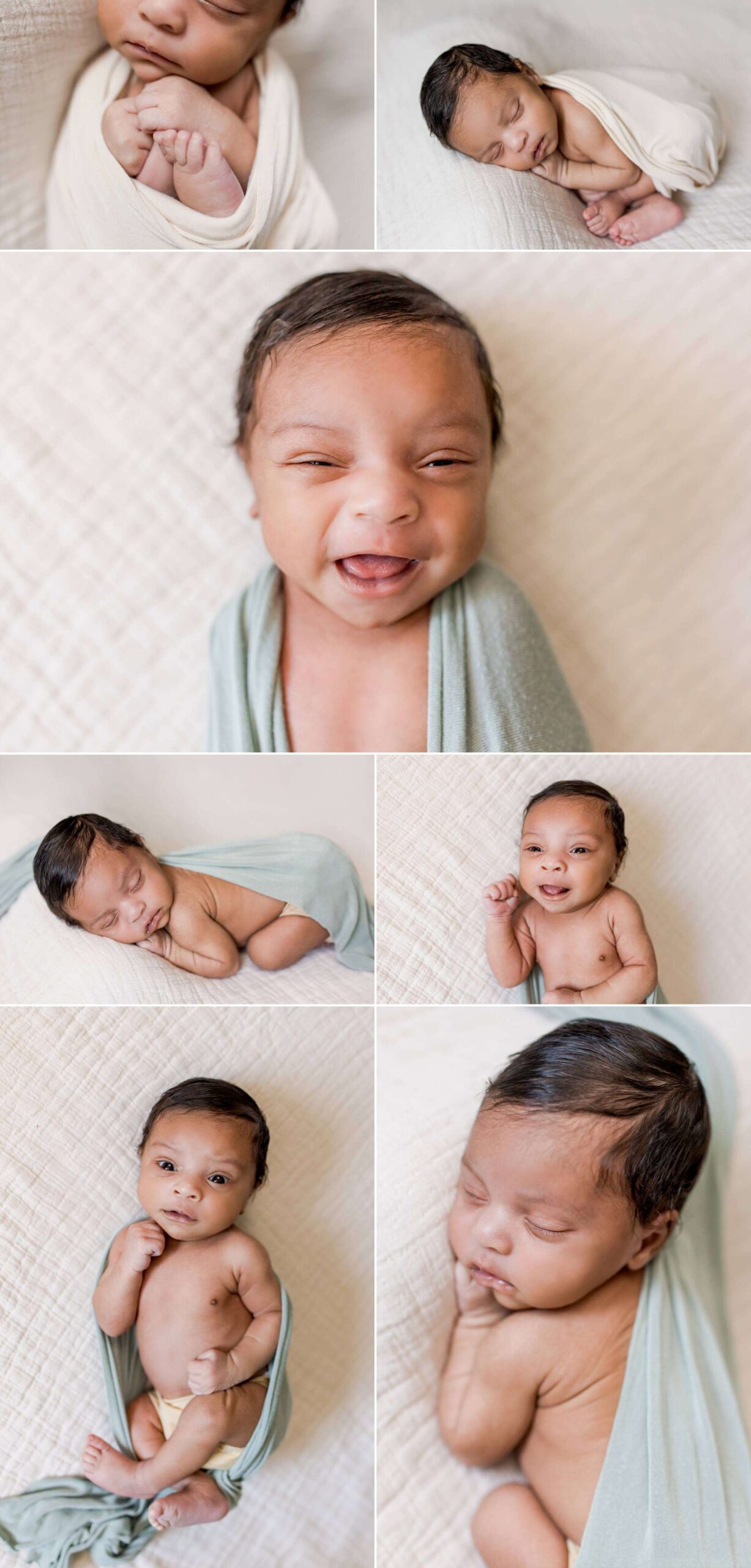 Afro American newborn boy on a cream blanket smiling at the camera and sleeping.